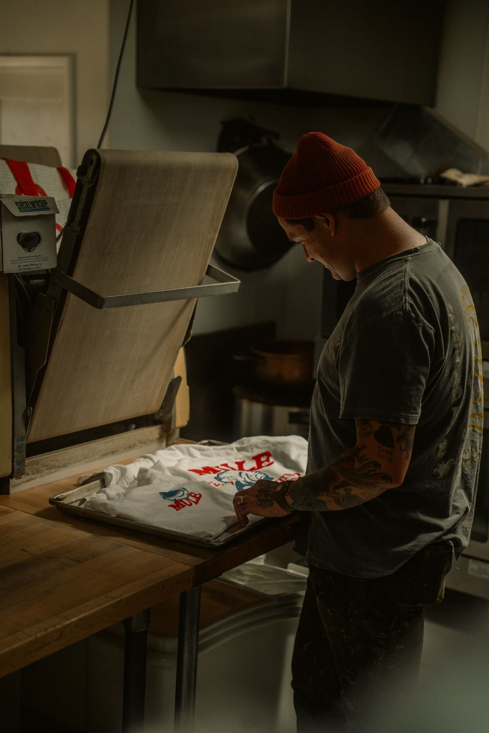 Heat pressing a printed transfer onto a t-shirt