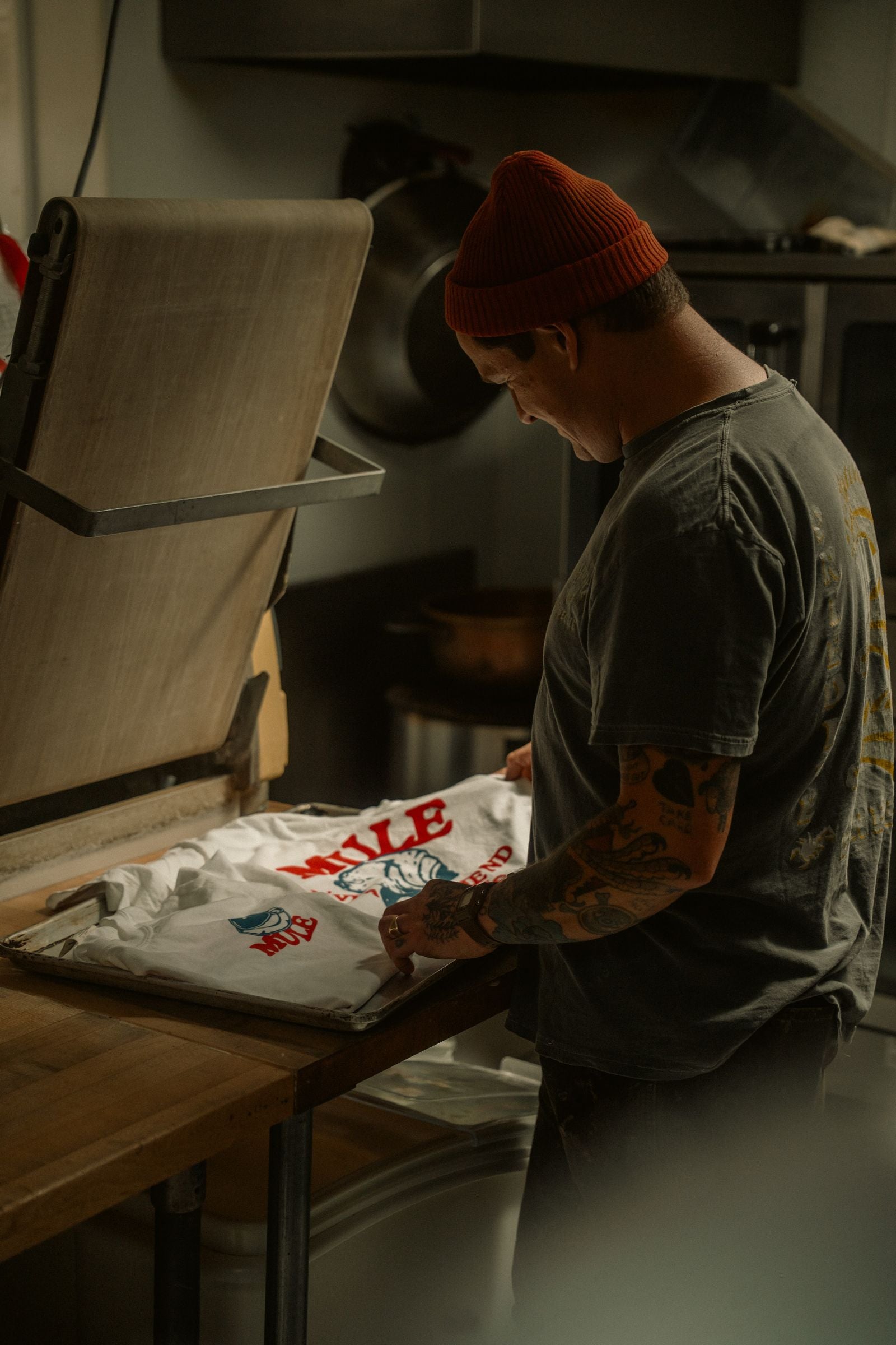 Pulling a print across a garment on the press